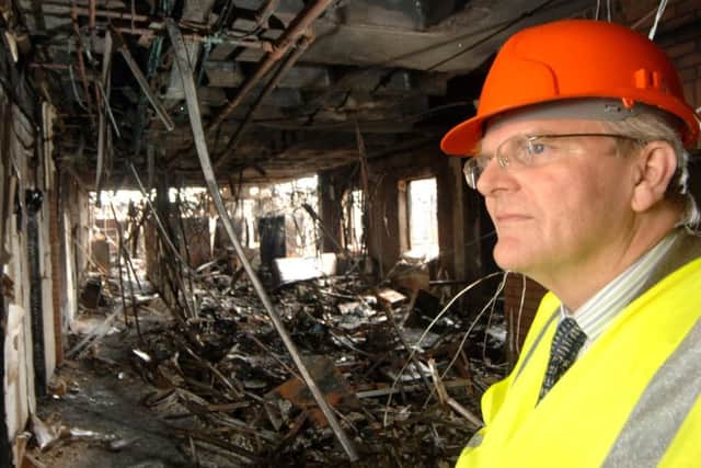 655455-7 : Â©Lionel Heap : Melton News : Burnt Out Melton Borough Council Offices - Interiors : Leader of Melton Borough Council Malise Graham inspects the damage. EMN-180523-153944001