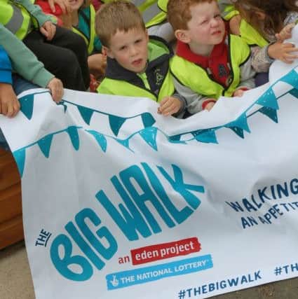Pre-school children on banner duty during visit by The Big Walk team EMN-180523-170301001