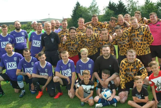 The teams line up before this year's annual Bobby Barnard Cup match, part of a charity fundraising day in Melton EMN-180529-101529001