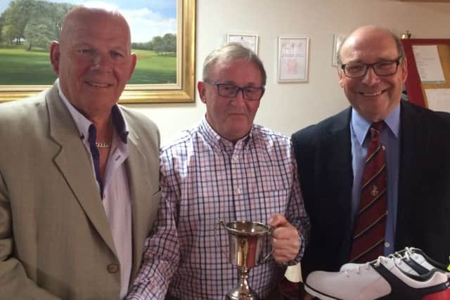 Senior Open champion Terry Haggerty is flanked by Stoke Rochford seniors captain Brian White (left), and organiser Mike Dickinson EMN-180529-125329002