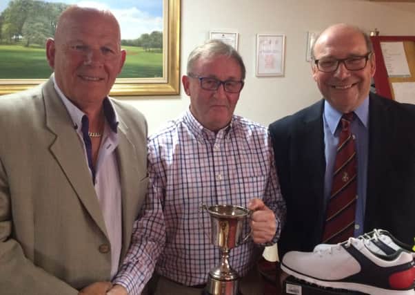 Senior Open champion Terry Haggerty is flanked by Stoke Rochford seniors captain Brian White (left), and organiser Mike Dickinson EMN-180529-125329002