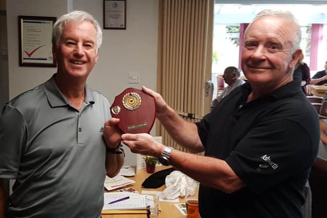 Teachers captain Haydn Snow (left) receives the trophy from Medics skipper Steve Middleton EMN-180529-110628002