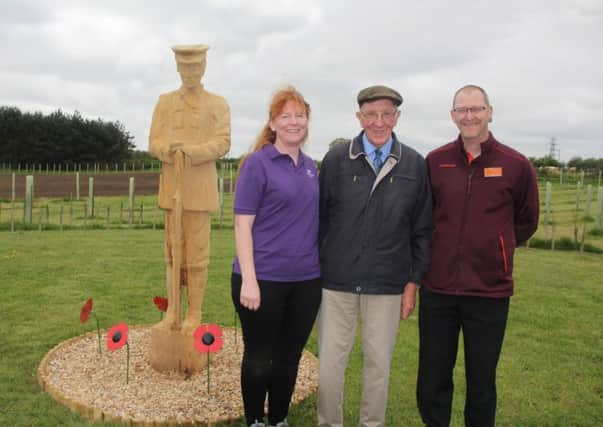 Widmerpool farmer Geoff Brooks (centre) at his new Great War memorial woodland with Claire Martin (Woodland Trust First World War project manager) and Andrew Jameson (Sainsburys Great Place To Work representative) EMN-180506-110840001
