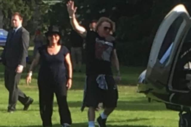Axl Rose waves as he boards the helicopter PHOTO: Stapleford Miniature Railway