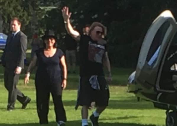 Axl Rose waves as he boards the helicopter PHOTO: Stapleford Miniature Railway