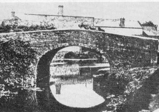 The first bridge over the old Oakham Canal after leaving the basin at the end of the Melton Mowbray Navigation pictured in 1870 - it was sited approximately where the Melton Borough Council offices are now and carried Burton Street over the waterway EMN-180506-135619001