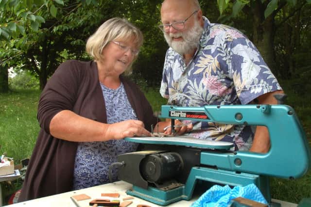 Shanti Patman gets some advice from Lloyd Stevens on the scroll saw at a Melton Space session EMN-180806-095217001