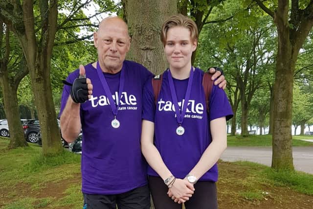 Bob White and step-grand-daughter Joni who raised more than £700 for a cancer charity campaign with a cycle around Rutland Water EMN-181106-114822001
