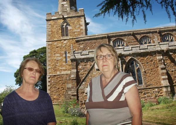 Treasurer Kathryn Letts and Sandra Leeson (left) at St Peter's Church, at Tilton on the Hill, where thieves have stolen lead from the roof three times in six months EMN-181106-174445001