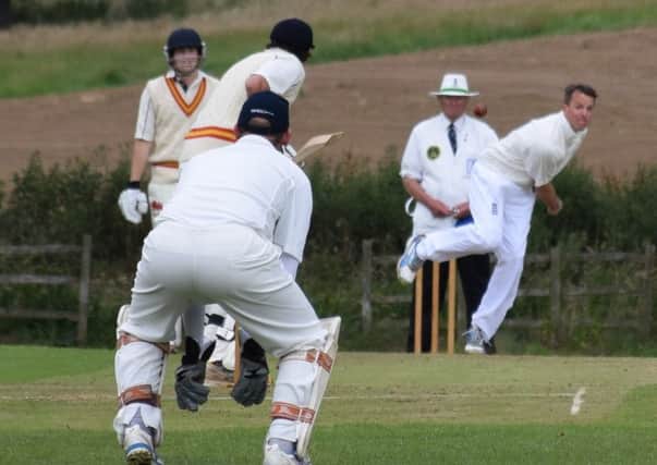 Vic Heppenstall keeps a close eye on Graeme Swann during a Belvoir Cricket and Countryside Trust feature match EMN-181206-180702002