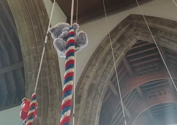 A teddy descends from the church bell tower PHOTO: Supplied