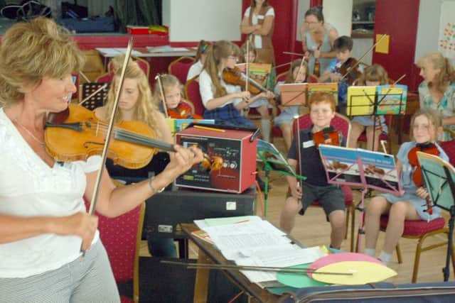 Zosia Cocker and local school violinists PHOTO: Tim Williams