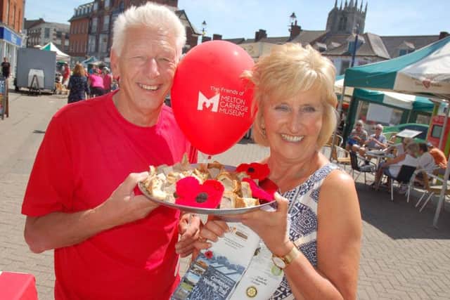 Derek Simmonds and Jenny Barnes promote the Melton Centenary Trail in aid of Birch Wood Area Special School at the town's Paint The Town Red event on Sunday EMN-180625-125626001