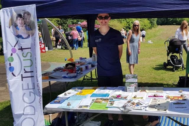 A volunteer mans The Lodge Trust's information stand PHOTO: Supplied