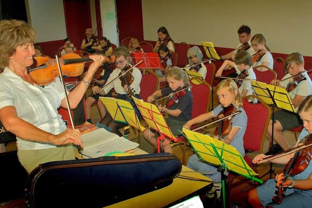 Zosia Cocker with school violinists PHOTO: Tim Williams
