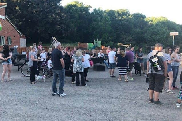 Residents and supporters pictured as they gathered before a search for Suzie.