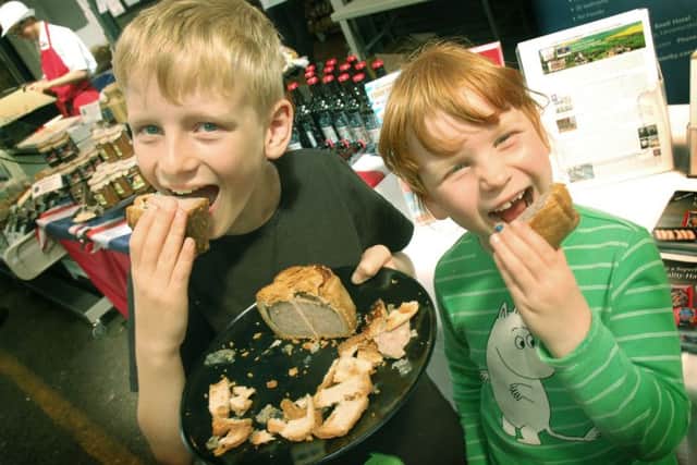 Young pork pie fans Daniel Bystrom and sister Anna show how festival tasting should be done PHOTO: Tim Williams