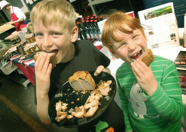 Young pork pie fans Daniel Bystrom and sister Anna show how festival tasting should be done PHOTO: Tim Williams