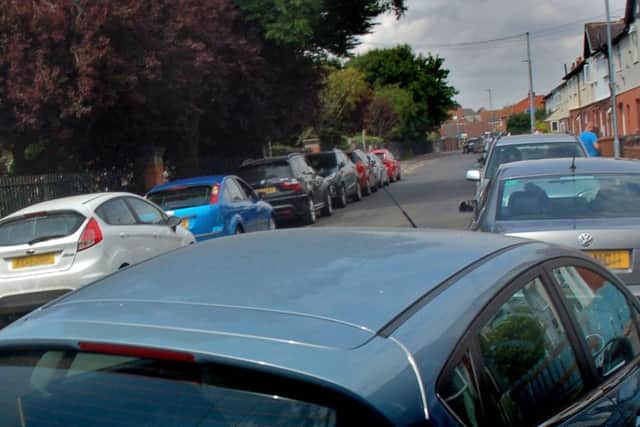 Parked cars outside Brownlow Primary School, Melton, on Monday afternoon - there has been an issue with parents blocking the road and 'no parking' places for many years EMN-180907-163447001