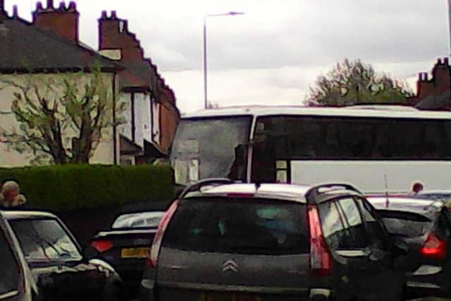 Congested traffic at the junciton of Kings Road and Limes Avenue caused by parents waiting for children outside Brownlow Primary School. It was sent in by an anonymous resident of Kings Road EMN-180907-171440001