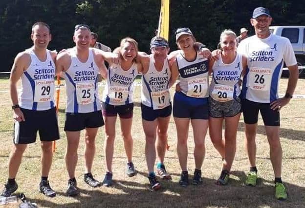 The Stilton Striders group at the Hucklow fell face EMN-181007-181654002
