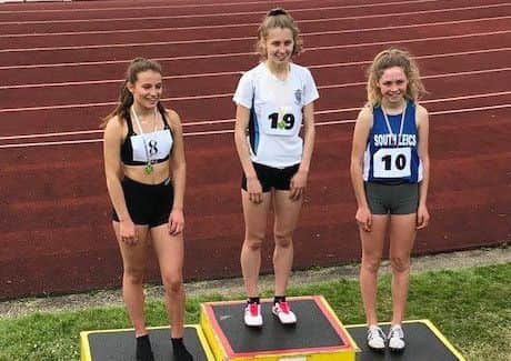 Mia Atkinson tops the podium at the Leicestershire Schools Athletics Championships EMN-181107-113907002