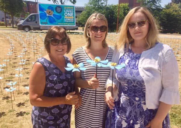 Catherine Ashman-Lee (right), who is supporting the LOROS Forget Me Not flower campaign, with her mum, Kate Wilkins (left) and friend, Rachel Starkey EMN-180713-125650001