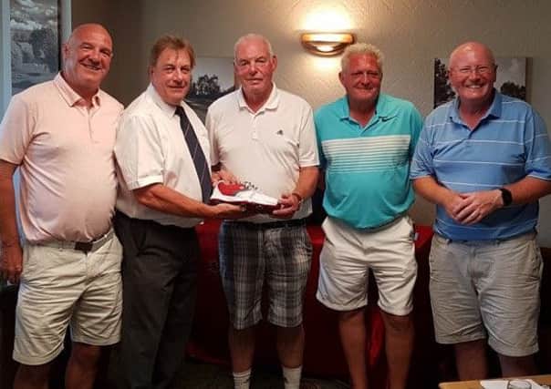 Melton Golf Club captain Glenn Price (second left) and Brendan Boyce with the Stilton Open winners EMN-180717-123801002
