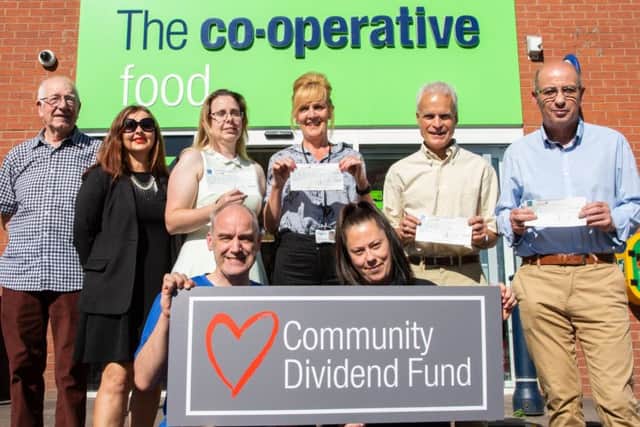 Representatives from Melton Community Allotment Project, Melton Learning Hub and other groups in Leicestershire celebrate being handed their grant from the Central England Co-operative Community Dividend Fund PHOTO: Alex Cantrill-Jones/ACJ Media