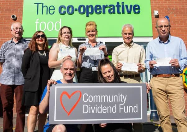 Representatives from Melton Community Allotment Project, Melton Learning Hub and other groups in Leicestershire celebrate being handed their grant from the Central England Co-operative Community Dividend Fund PHOTO: Alex Cantrill-Jones/ACJ Media