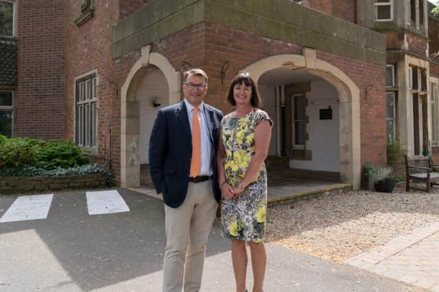 Directors of Rotherhill Developments, Paul Bagshaw and Sally Bagshaw outside their new offices at Pera.