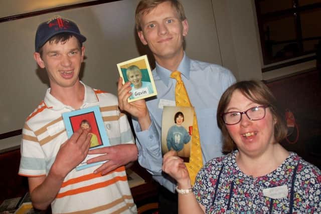 Former pupils Matthew Colford, Gavin Devlin and Alison Bailey compare their old school photos at a reunion for The Mount School at Melton EMN-180724-131621001