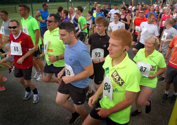 Time for a warm-up before the fun run PHOTO: Tim Williams