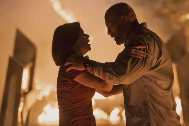 Neve Campbell as Sarah Sawyer and Dwayne Johnson as Will Sawyer PHOTO: PA Photo/Universal Pictures/Kimberley French