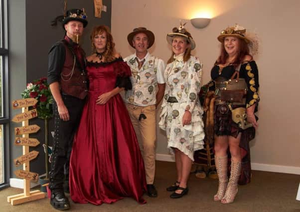 Guests at a steampunk themed wedding at Long Clawson EMN-180108-112945001