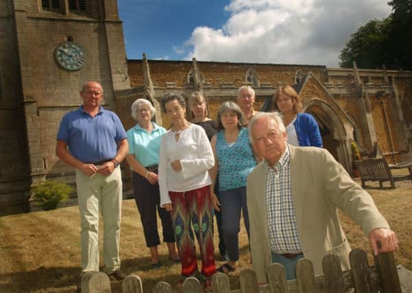 Churchwarden Martin Watts, who was fined for repairing the roof of All Saints' at Pickwell with an unapproved material, with members of the parochial church council EMN-180108-120123001