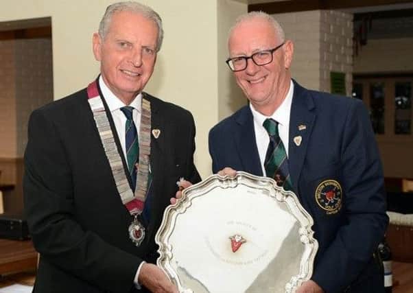 Melton GC past captain Ian Solloway (right) topped a field of 36 to win the Leicestershire and Rutland Golf Captains 2018 Championship. He is pictured being presented with the winners' prize by the Society president Charles Gearey EMN-180708-124324002