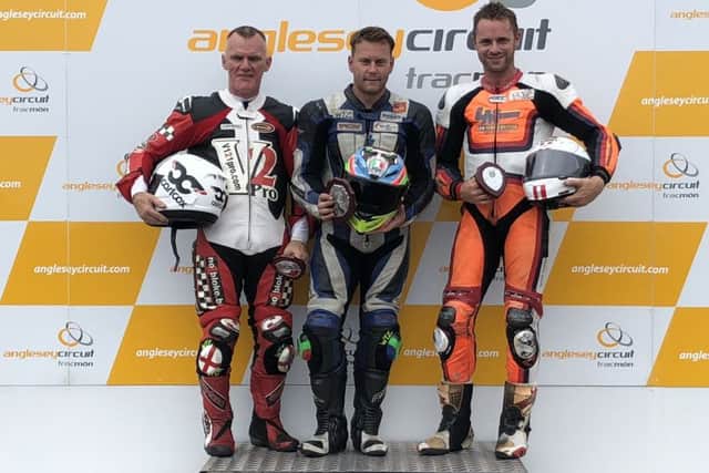 Ant Hart on the podium (right), with Phil Atkinson, and Mike Edwards (left). EMN-180808-114050002