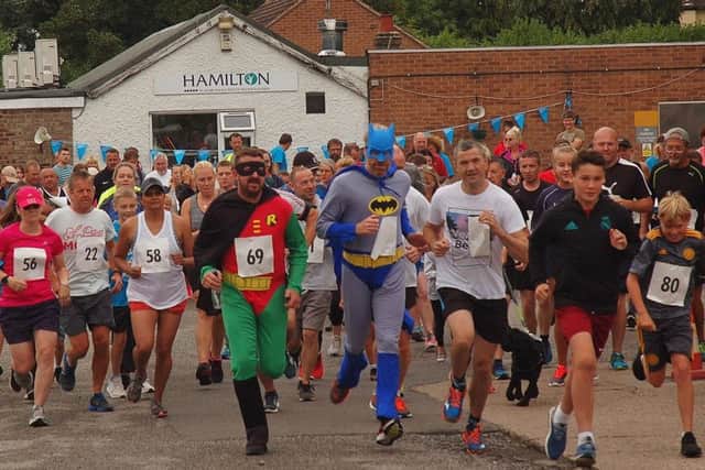 Batman and Robin lead the way from Hamilton Tennis Club PHOTO: Tim Williams