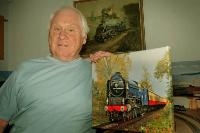Steam train enthusiast Paul Davies with some of the railway memorabilia he has collected EMN-180813-095003001