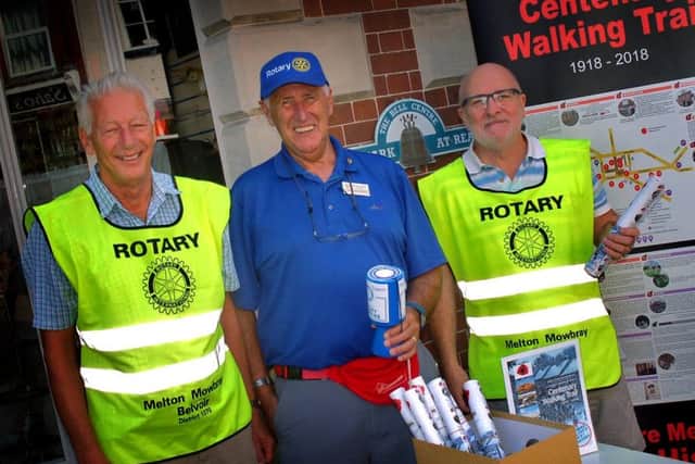 Derek Simmonds and fellow members of the Melton Belvoir Rotary Club, Ken Eggleston and Tony Wallis, sell their World War One Centenary Trail guides to mark the 100th anniversary of the end of the conflict EMN-180813-134422001