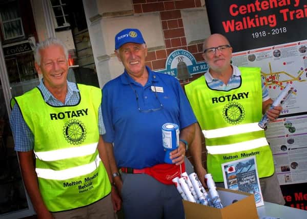Derek Simmonds and fellow members of the Melton Belvoir Rotary Club, Ken Eggleston and Tony Wallis, sell their World War One Centenary Trail guides to mark the 100th anniversary of the end of the conflict EMN-180813-134422001