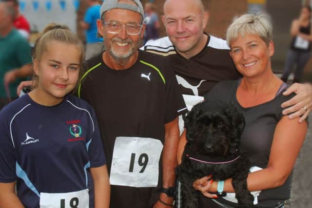 Chris Genes (second left) and family, granddaughter Sophie Varley, Simon and Nikola Dolphin - Rowland and Sid the dog PHOTO: Tim Williams