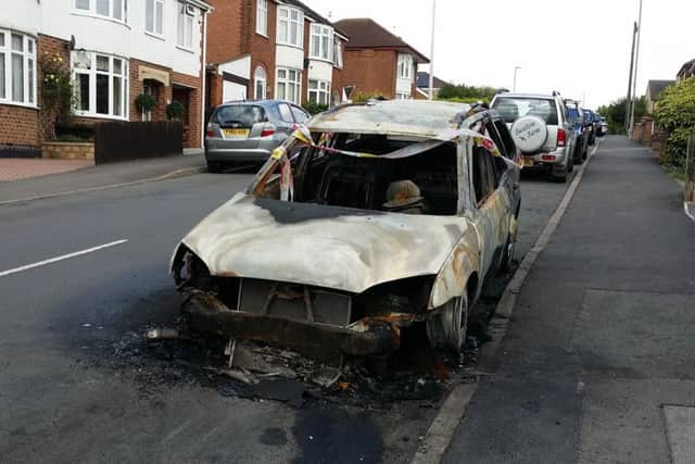 A Ford Mondeo destroyed by an arson attack in The Crescent in the early hours of Saturday - one of two cars sets alight deliberately in separate incidents five minutes apart in Melton EMN-180813-174819001