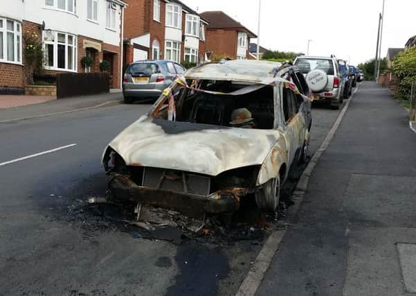A Ford Mondeo destroyed by an arson attack in The Crescent in the early hours of Saturday - one of two cars sets alight deliberately in separate incidents five minutes apart in Melton EMN-180813-174819001