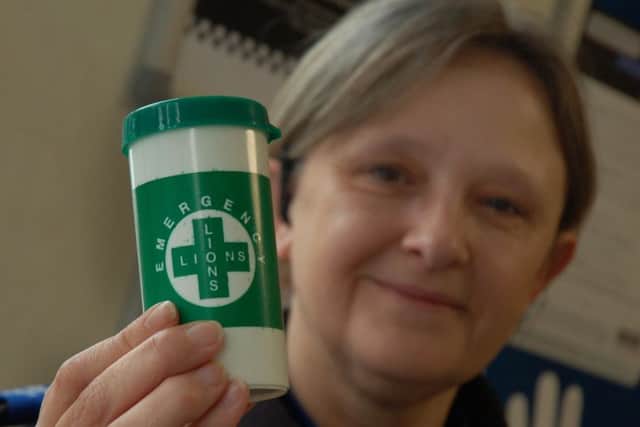 PCSO Karen Evans, who is based at Melton police station, with one of the special bottles being given out to vulnerable residents EMN-180814-094603001