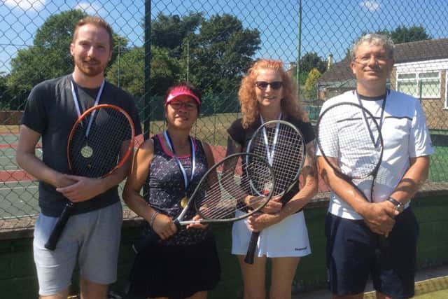 Mixed handicap tournament winners Joe Jackson and Suzan Galloway (left) with finalists Jan Jackson and Patrick Belcher EMN-180814-161327002