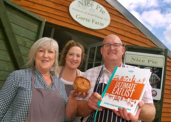 Nice Pie owners Phil and Kath Walmsley celebrate the business being recognised for its pork pies in a new Lonely Planet book for the top 500 meals in the world EMN-180821-162759001