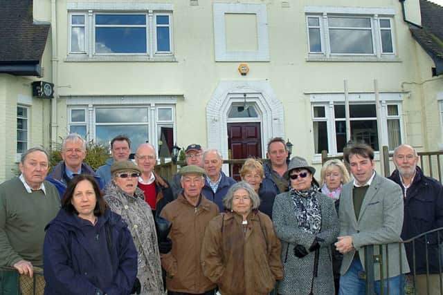 Melton borough councillor Leigh Higgins (second from right) outside The Fox Inn at Thorpe Satchville with villagers in March 2017 during a previous battle to prevent it being redeveloped for housing EMN-180821-120524001