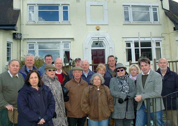 Melton borough councillor Leigh Higgins (second from right) outside The Fox Inn at Thorpe Satchville with villagers in March 2017 during a previous battle to prevent it being redeveloped for housing EMN-180821-120524001